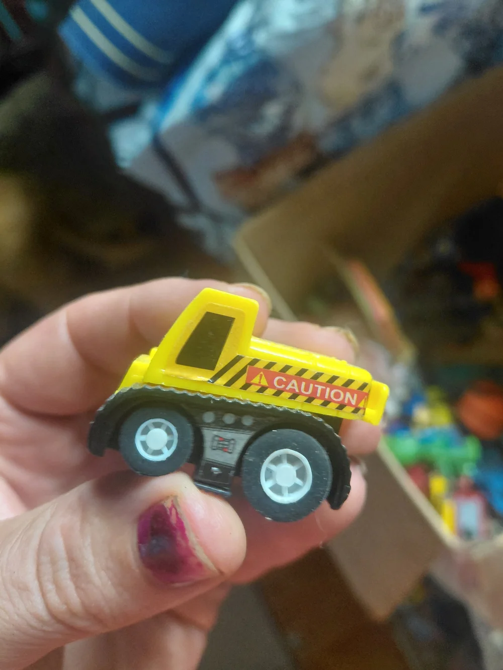 yellow plastic Kid Galaxy bulldozer toy features 